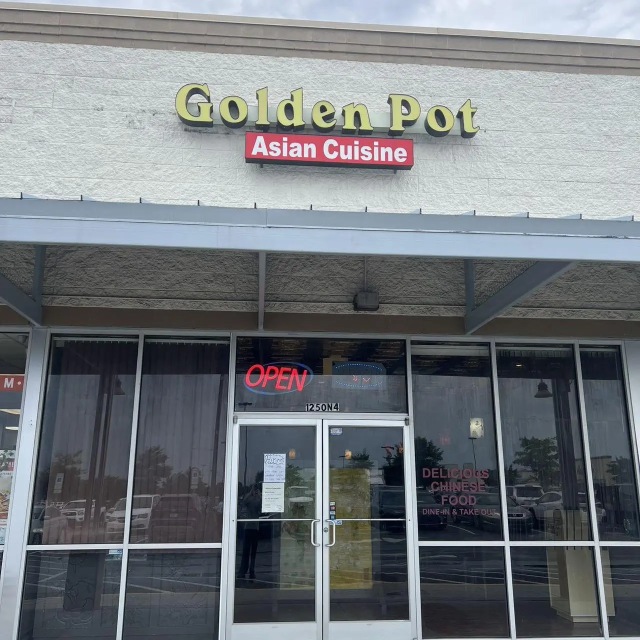 Golden-Pot-Asian-Restaurant-Exterior-Jacksonville Exterior of Golden Pot Asian Restaurant with “OPEN” sign.